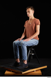 Alessandro Katz  black shoes blue jeans brown t shirt casual dressed sitting whole body  jpg